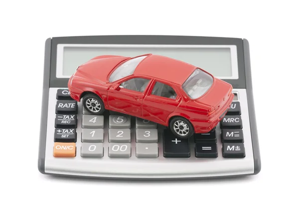 Калькулятор и красный автомобиль игрушек с обтравочного контура — стоковое фото