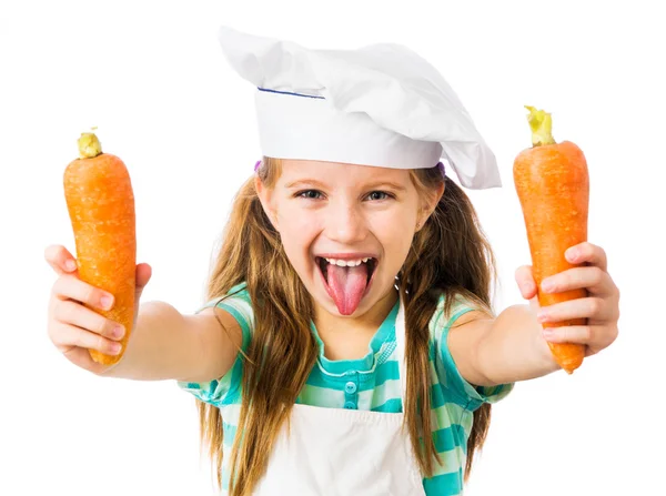 Маленькая девочка с морковью — стоковое фото