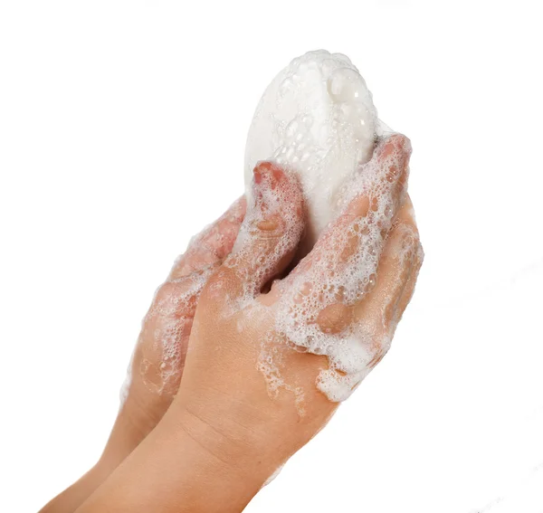 Lathered руки и мыло — стоковое фото
