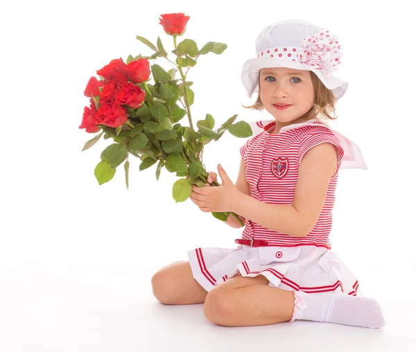 Очаровательная девушка с розой в руке — стоковое фото