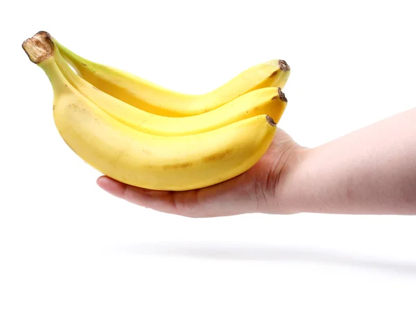 Связка зрелых бананов в женской руке — стоковое фото