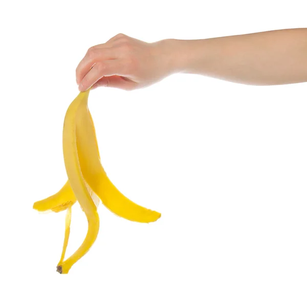 Кожи из банана в женской руке, изолированные на белом — стоковое фото