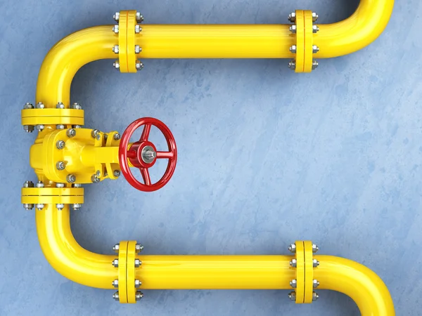 Желтый газовый клапан газопровода на голубой стене. Пространство для текста — стоковое фото