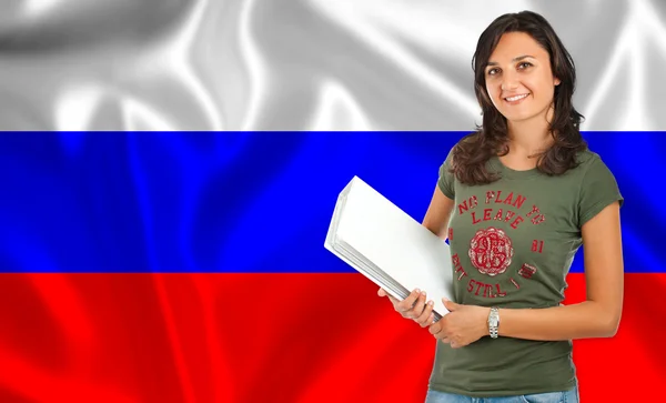Студент улыбаясь за российский флаг — стоковое фото