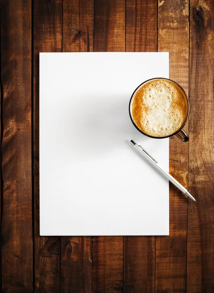 Blank letterhead, coffee and pen — стоковое фото