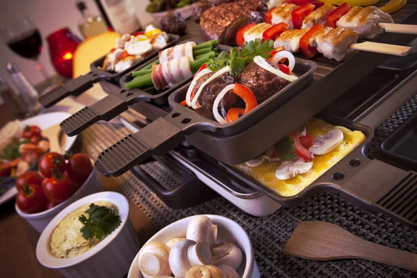Raclette table-top grill or the Dutch variant 'gourmetten' — стоковое фото