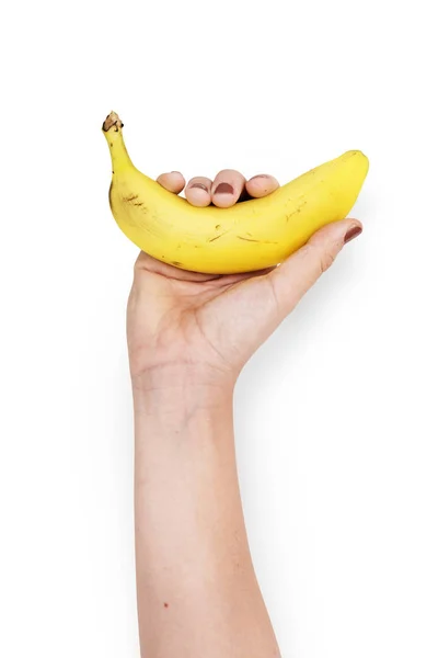 Рука Холдинг банан — стоковое фото