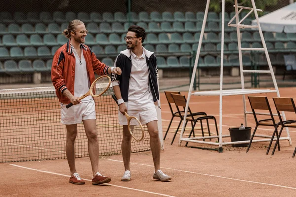 Smiling Handsome Tennis Players Walking Looking Each Other Court — стоковое фото