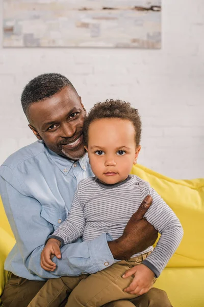 Happy African American Grandfather Adorable Little Grandson Looking Camera — стоковое фото