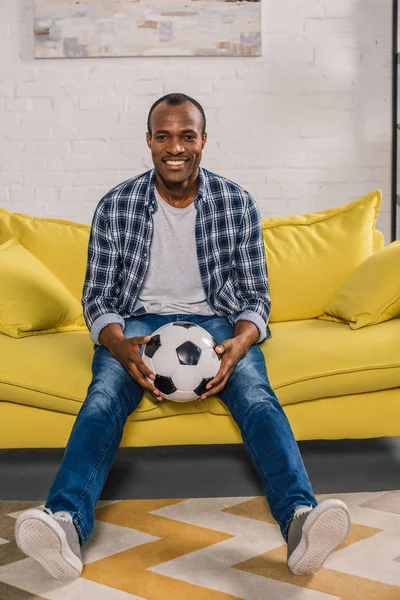 Cheerful African American Man Holding Soccer Ball Smiling Camera While — стоковое фото