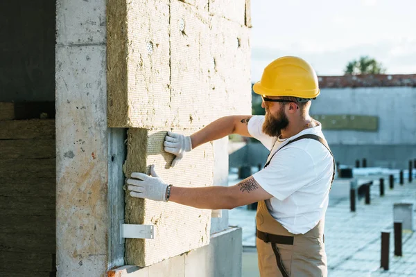 Builder Protective Helmet Googles Doing Insulation Wall Construction Site — стоковое фото