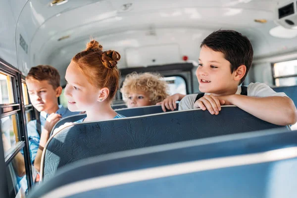 Group Pupils Riding School Bus Looking Window — стоковое фото