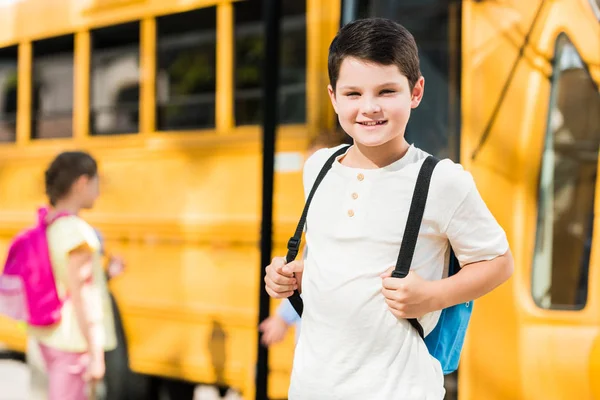 Happy Little Schoolboy Backpack Standing Front School Bus — стоковое фото