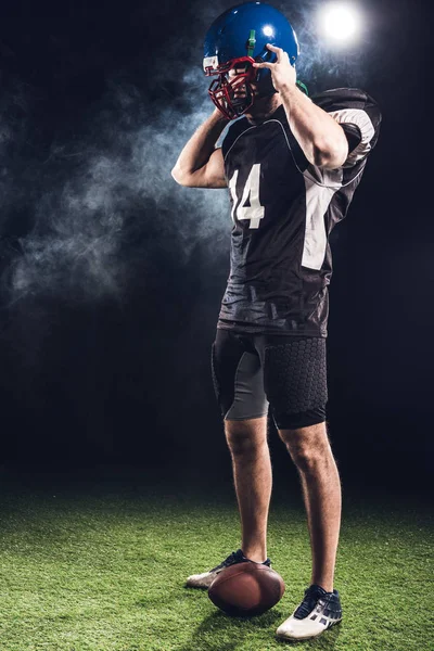 Young American Football Player Taking Helmet Black — стоковое фото
