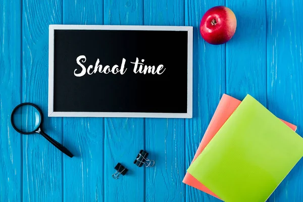 Top View Blackboard Lettering School Time Apple Stationery Blue Wooden — стоковое фото