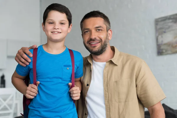 Portrait Smiling Father Son Backpack Home Back School Concept — стоковое фото