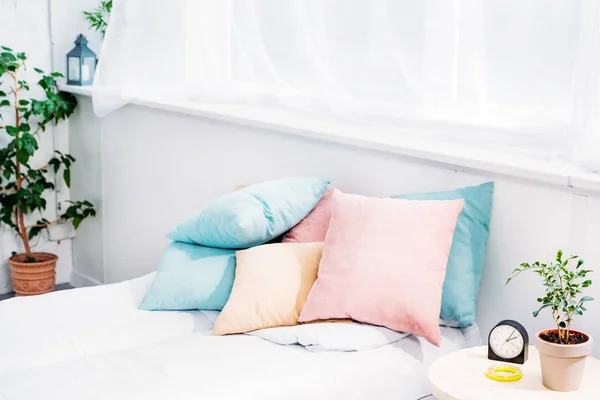 Comfy Bed Lot Pillows Modern Light Room Alarm Clock Plant — стоковое фото