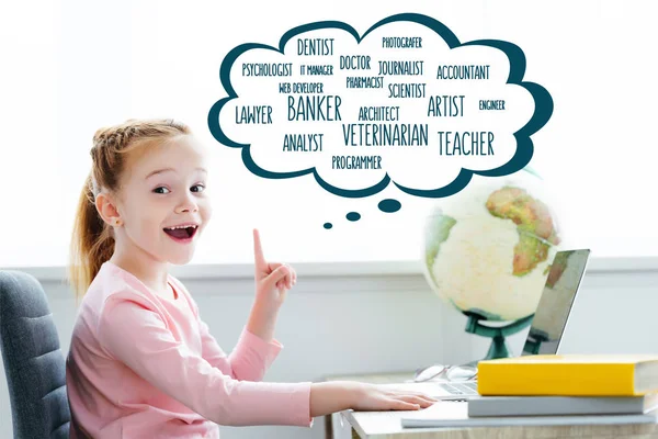 Cheerful Redhead Child Studying Books Laptop Pointing Words Different Professions — стоковое фото