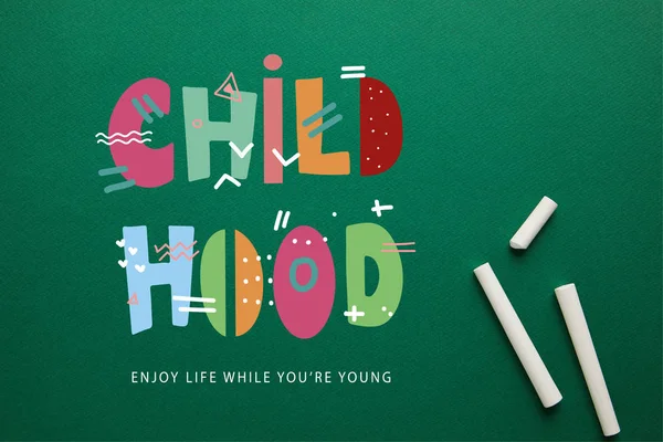 Top View White Chalks Green Blackboard Childhood Enjoy Life While — стоковое фото