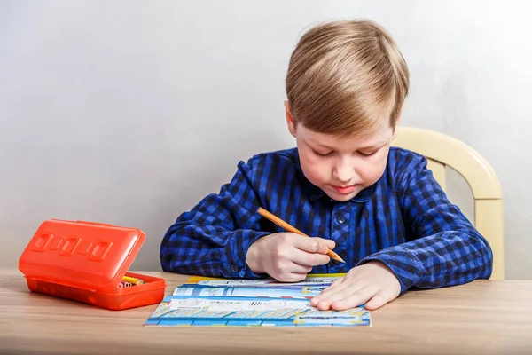 Seven Year Old Boy Draws Coloring Desk First Grader — стоковое фото
