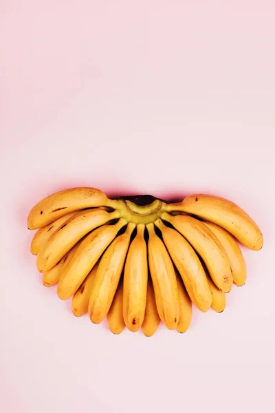 Bunch Baby Bananas Pink Background Flat Lay Style — стоковое фото