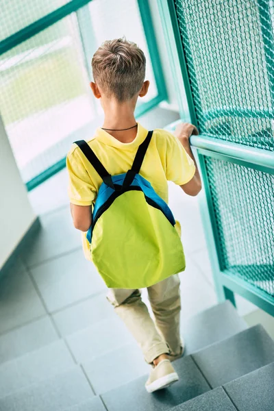 Rear View Schoolboy Backpack Going Downstairs School Corridor — стоковое фото