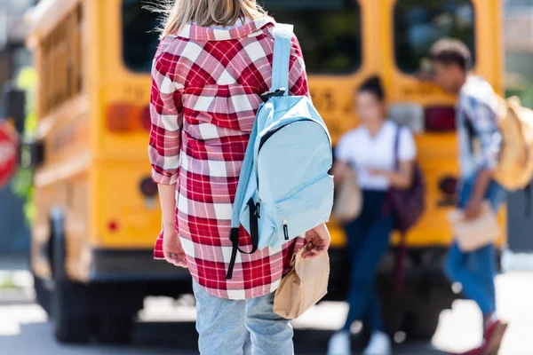 Rear View Teen Schoolgirl Walking Classmates Leaning School Bus — стоковое фото