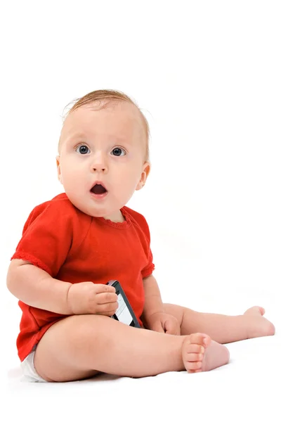 Фотография младенца в пеленки с телефоном клетки — стоковое фото