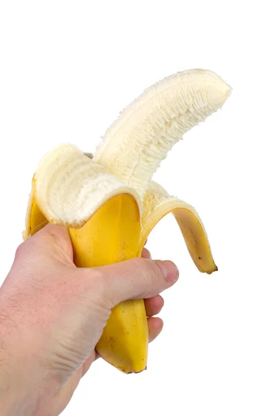Банан в руке на белом фоне — стоковое фото