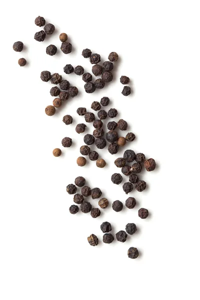 Черный Peppercords над белым вид сверху — стоковое фото